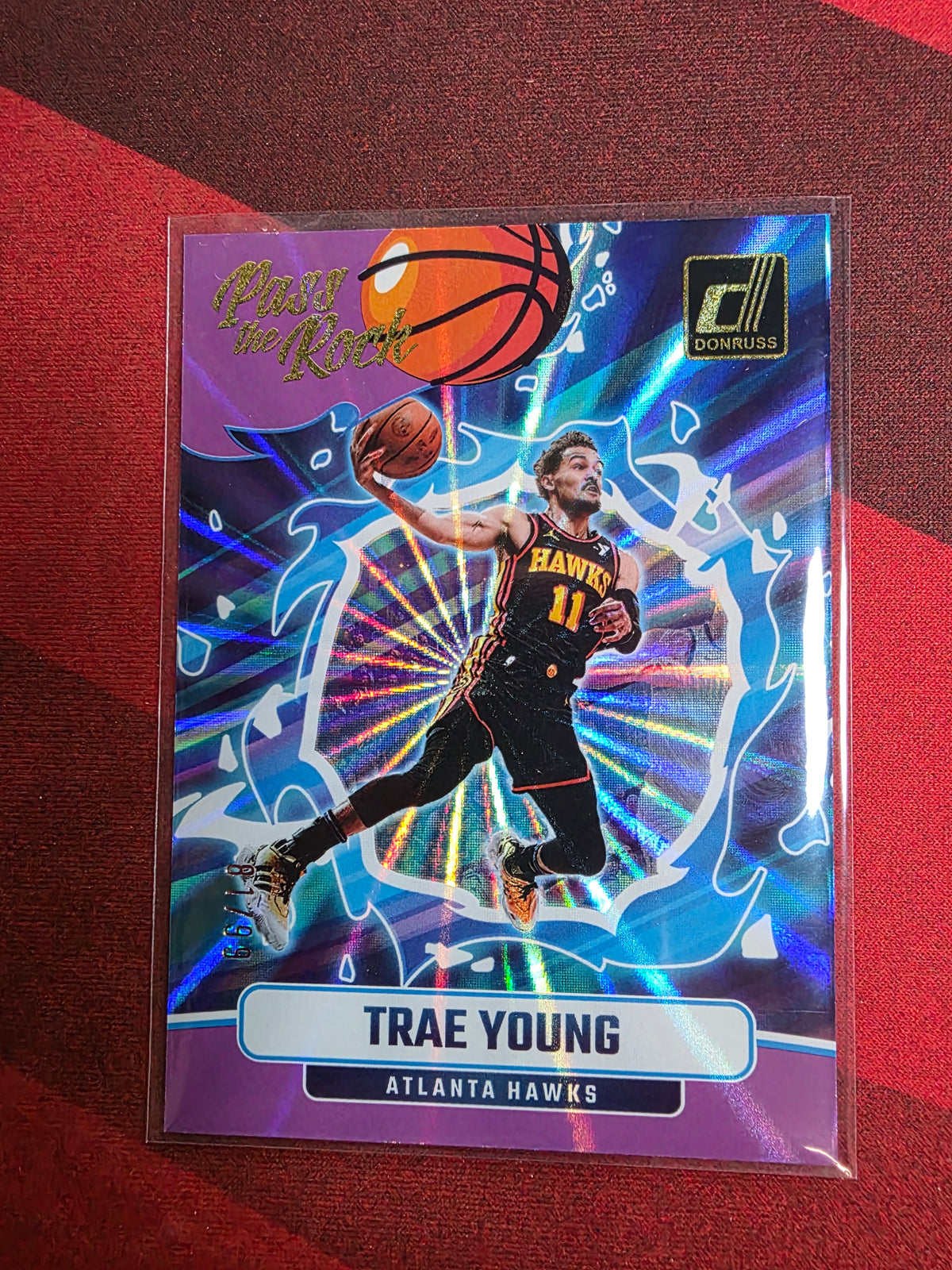 Trae Young #19 Pass the Rock Purple Press Proof /99 – 2024-25 Donruss Basketball
